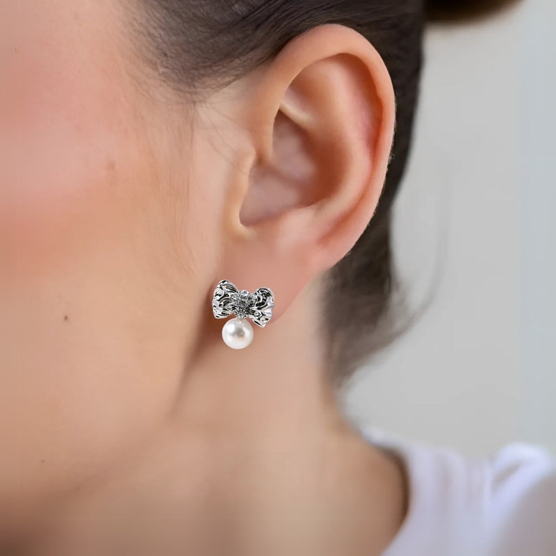 Hammered And Dainty Silver Bow Studs