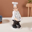 Apron Holding Chef Decor