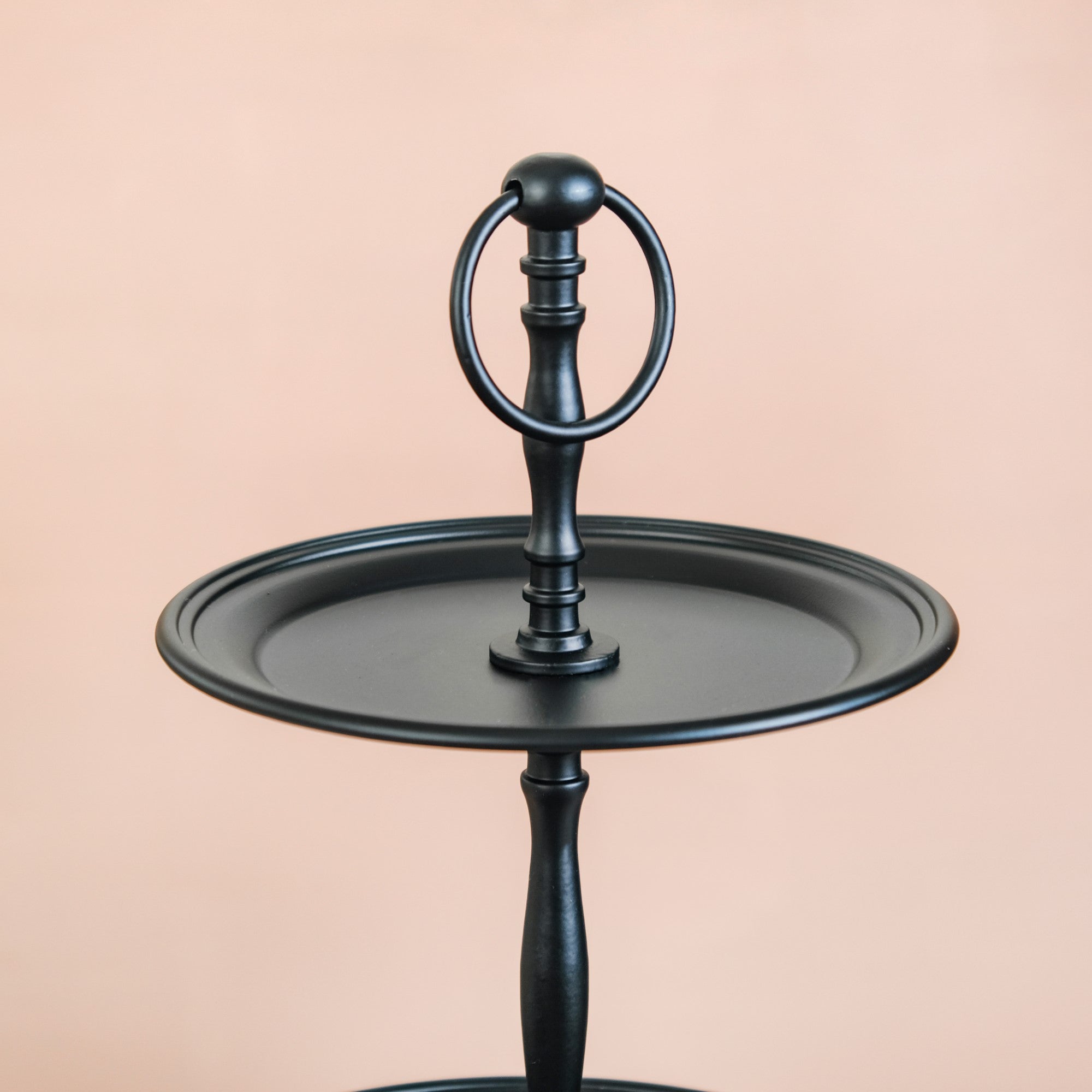 Black metal outlet cake stand