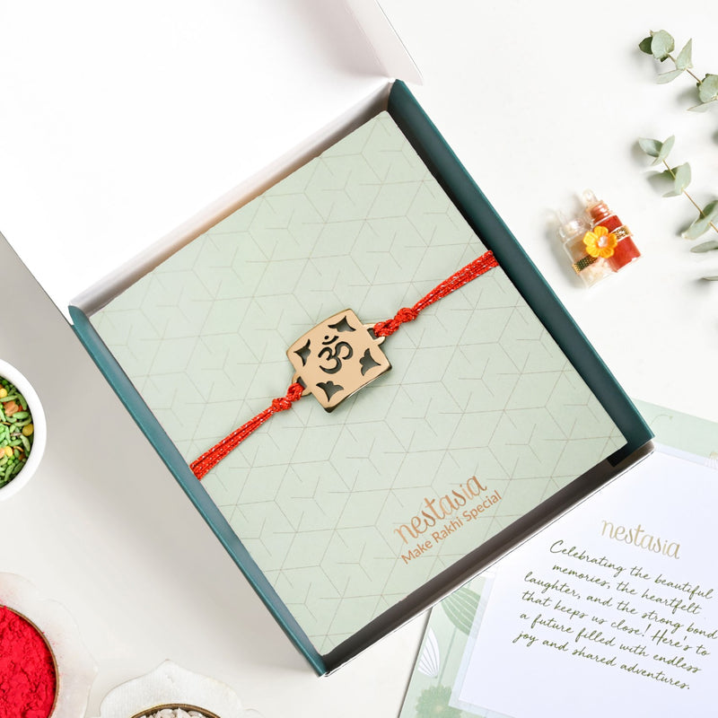 Om Square Brass Rakhi With Golden Finish Gift Set