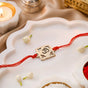 Om Square Brass Rakhi With Golden Finish Gift Set
