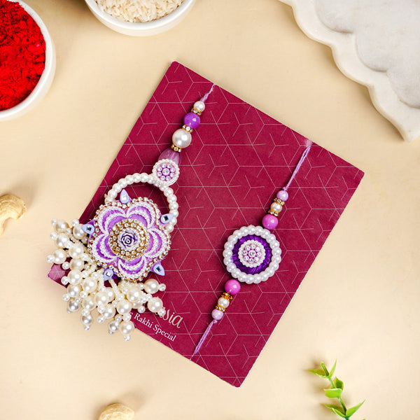Purple Pearl Beaded Rakhi With Floral Lumba For Couples