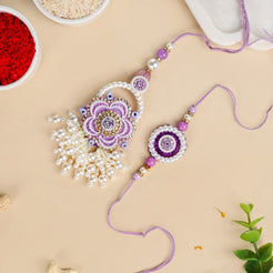 Purple Pearl Beaded Rakhi With Floral Lumba For Couples