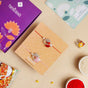 Rose and Pearl Set Of 2 Rakhi Gift Set